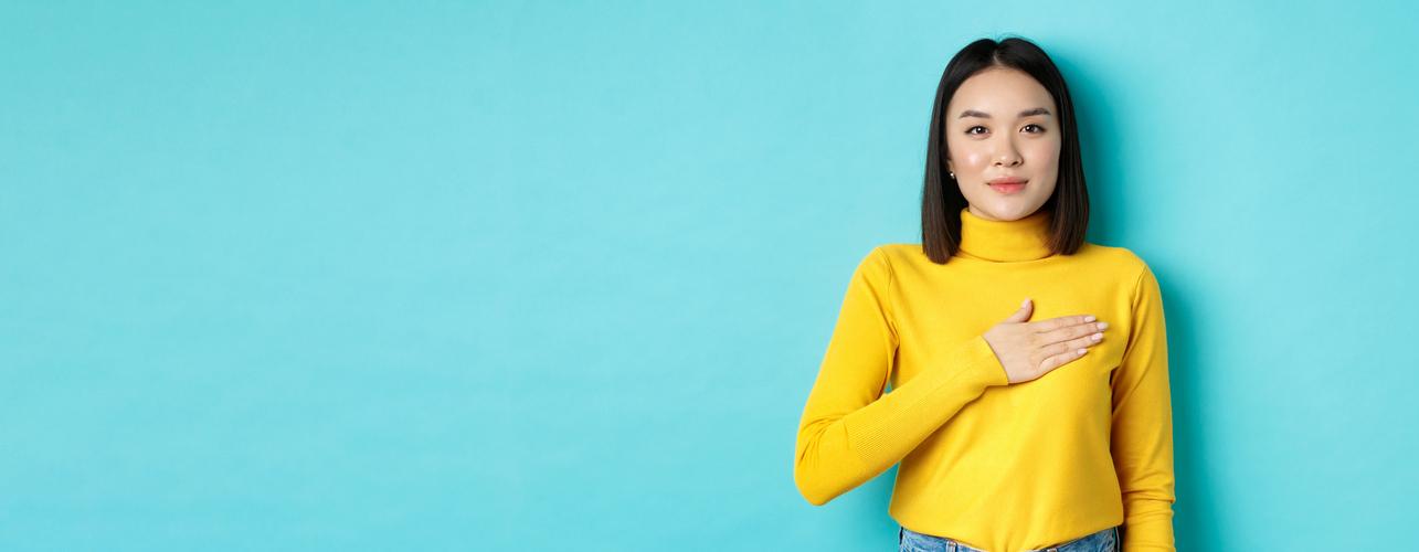 proud-smiling-holding-hand-heart